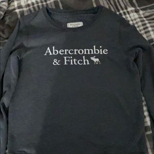 A grey crewneck sweater